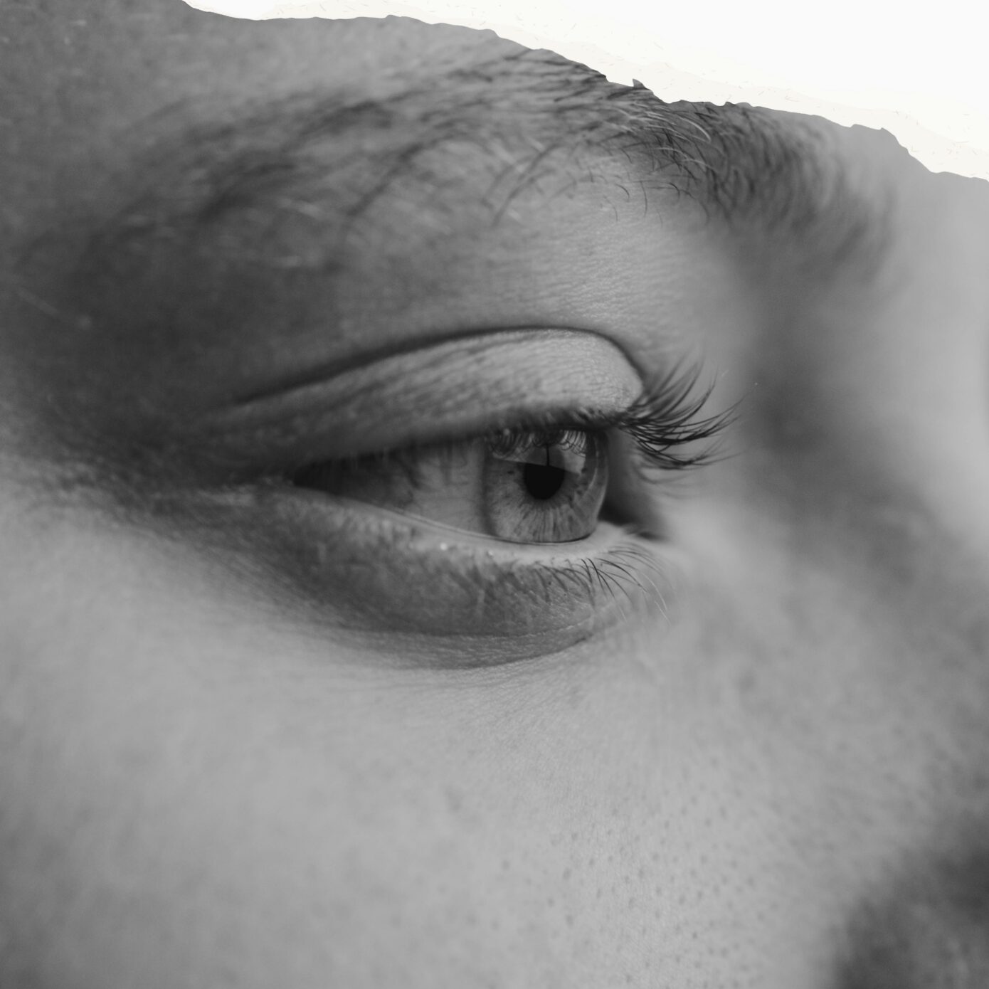 Woman looking thoughtfully into the distance representing high-functioning depression, emotional exhaustion and losing yourself while appearing to cope.